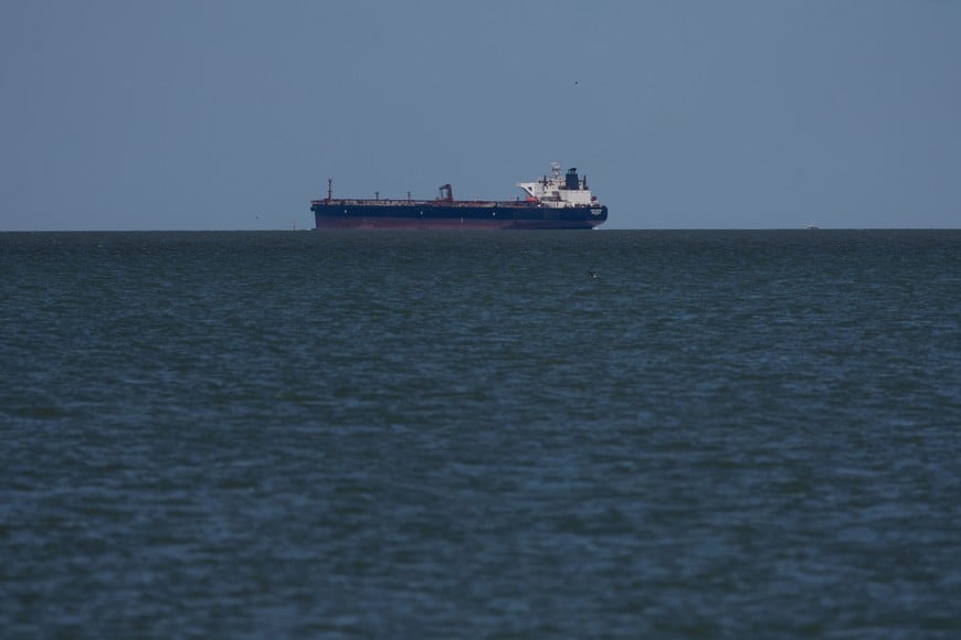 FILE PHOTO: The Soho Square, a crude oil tanker sailing under the flag of Liberia, is at anchor in the Galveston Bay as it makes it’s way to the Port of Houston shortly after U.S. President Donald Trump announced a 60-day waiver of the Jones Act shipping law, in Texas City, Texas, U.S. March 18, 2026. REUTERS/Antranik Tavitian/File Photo