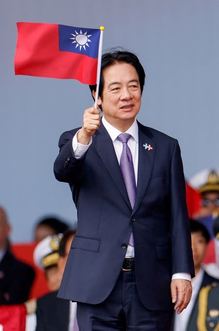 Taiwan President Lai Ching-te waves a Taiwanese flags during National Day celebrations in Taipei, Taiwan, October 10, 2026. REUTERS/Ann Wang