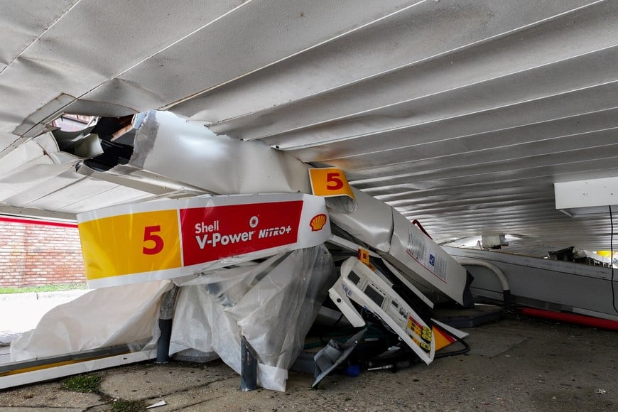 A drone view shows the fallen roof and broken equipment of a gas station in the aftermath of Hurricane Isaias in Gulf Breeze, Florida, U.S., October 10, 2026. REUTERS/Marco Bello