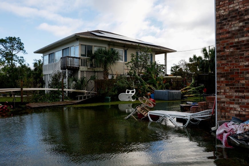 A backyard is flooded in the aftermath of Hurricane Isaias, in Destin, Florida, US, October 10, 2026. REUTERS/Marco Bello