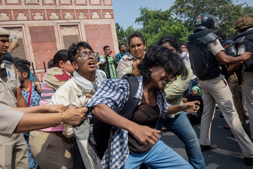 Protesters are detained by security personnel during a protest by the Cockroach Janta Party (CJP) seeking the resignation of India's Chief Election Commissioner Gyanesh Kumar, near the protest site in New Delhi, India, October 10, 2026. REUTERS/Adnan Abidi