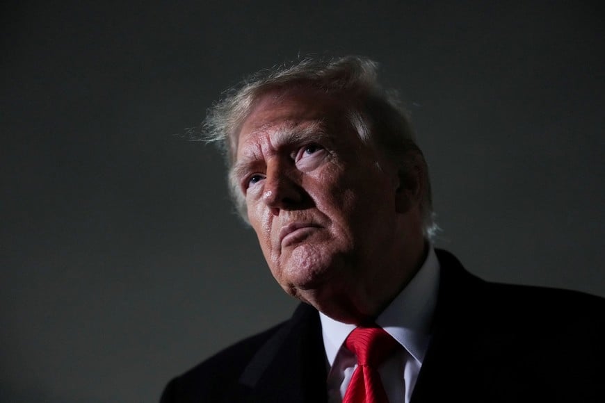 US President Donald Trump looks on as he speaks to the media after disembarking Air Force One, after attending a campaign rally in Clarksville, Tennessee, at Joint Base Andrews, Maryland, US, October 10, 2026. REUTERS/Eric Lee