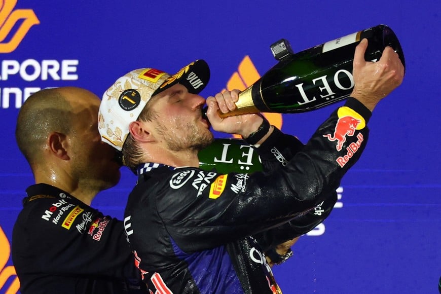 Formula One F1 - Singapore Grand Prix - Marina Bay Street Circuit, Singapore - October 11, 2026
Red Bull's Max Verstappen celebrates on the podium after winning the Singapore Grand Prix REUTERS/Edgar Su