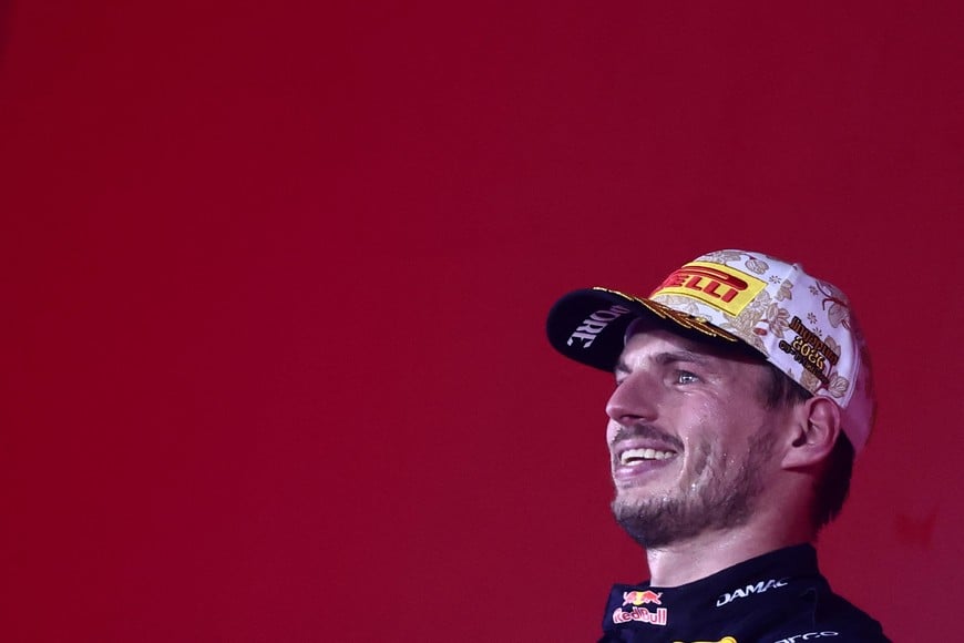 Formula One F1 - Singapore Grand Prix - Marina Bay Street Circuit, Singapore - October 11, 2026
Red Bull's Max Verstappen celebrates on the podium after winning the Singapore Grand Prix REUTERS/Jakub Porzycki