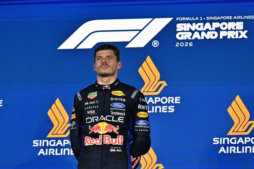 Formula One F1 - Singapore Grand Prix - Marina Bay Street Circuit, Singapore - October 11, 2026
Red Bull's Max Verstappen celebrates on the podium after winning the Singapore Grand Prix REUTERS/Caroline Chia