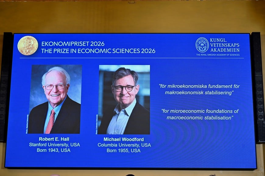 Images of Robert E. Hall and Michael Woodford are displayed as they are announced as the laureates of the 2026 Sveriges Riksbank Prize in Economic Sciences in Memory of Alfred Nobel at the Royal Swedish Academy of Sciences in Stockholm, Sweden, on October 12, 2026. TT News Agency/Anders Wiklund via REUTERS ATTENTION EDITORS - THIS IMAGE WAS PROVIDED BY A THIRD PARTY. NO RESALES. NO ARCHIVES. SWEDEN OUT. NO COMMERCIAL OR EDITORIAL SALES IN SWEDEN.