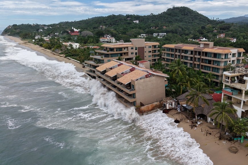 A drone view shows waves crash against beachfront buildings as Hurricane Simon remains off Mexico's Pacific coast, in San Francisco, Bahia de Banderas, Nayarit state, Mexico, October 12, 2026. REUTERS/Christian Ruano TPX IMAGES OF THE DAY
