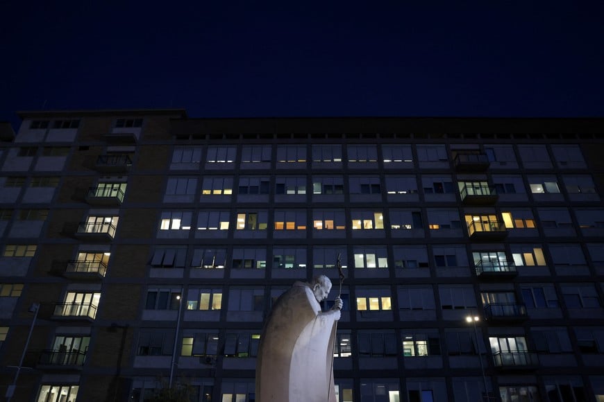 The statue of the late Pope John Paul II outside Gemelli Hospital, where Pope Leo is being treated for lung cancer following surgery to remove part of his right lung, in Rome, Italy, October 14, 2026. REUTERS/Yara Nardi
