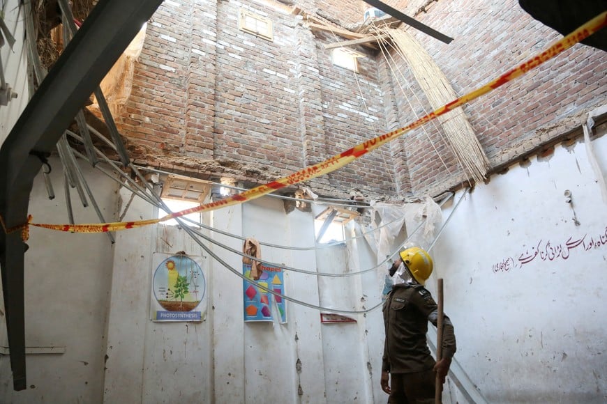 A rescue staff stands in a classroom after a school roof collapse in Peshawar, Pakistan, October 15, 2026. REUTERS TPX IMAGES OF THE DAY