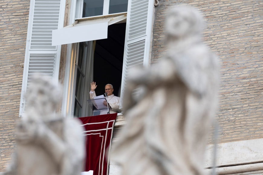 Pope Leo leads the Angelus prayer from a window of the Apostolic Palace following his discharge from hospital after surgery to remove part of his right lung following a cancer diagnosis, at the Vatican, October 18, 2026. REUTERS/Remo Casilli