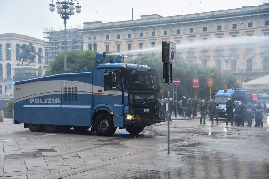 A police vehicle sprays a jet of water during a protest over the state of public services and the rising cost of living in Milan, Italy, October 18, 2026. REUTERS/Stringer