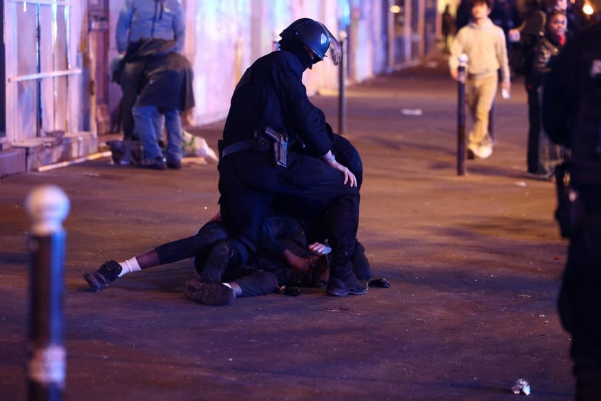 A demonstrator is detained during civil unrest, the day after a national day of demonstrations against the cost of living and rising fuel prices, in Paris, France, October 18, 2026. REUTERS/Abdul Saboor