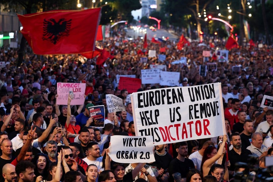 Protesters hold banners during a protest against a luxury resort, a plan by a company linked to Donald Trump's son-in-law, Jared Kushner, on an environmentally sensitive part of the Adriatic coast, in Tirana, Albania, June 7, 2026. REUTERS/Florion Goga
TPX IMAGES OF THE DAY