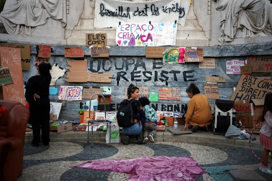 People at a protest camp Rossio square against house crisis and cost of living, in Lisbon, Portugal, October 19, 2026. REUTERS/Pedro Nunes