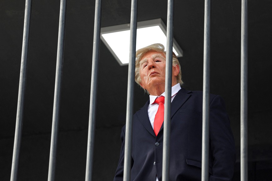 A person dressed up as US President Donald Trump looks on from inside a mock prison cell during a performance in Tehran, Iran, October 21, 2026. Majid Asgaripour/WANA (West Asia News Agency) via REUTERS ATTENTION EDITORS - THIS PICTURE WAS PROVIDED BY A THIRD PARTY. ISRAEL OUT. NO COMMERCIAL OR EDITORIAL SALES IN ISRAEL. NO ACCESS FOR ISRAELI MEDIA. NO USE BBC PERSIAN. NO USE VOA PERSIAN. NO USE MANOTO. NO USE IRAN INTERNATIONAL. NO USE RADIO FARDA. DIGITAL: NO USE BBC PERSIAN. NO USE VOA PERSIAN. NO USE MANOTO. NO USE IRAN INTERNATIONAL. NO USE RADIO FARDA.