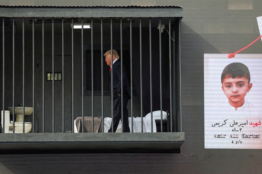 A person dressed up as US President Donald Trump walks inside a mock prison cell during a performance in Tehran, Iran, October 21, 2026. Majid Asgaripour/WANA (West Asia News Agency) via REUTERS ATTENTION EDITORS - THIS PICTURE WAS PROVIDED BY A THIRD PARTY. ISRAEL OUT. NO COMMERCIAL OR EDITORIAL SALES IN ISRAEL. NO ACCESS FOR ISRAELI MEDIA. NO USE BBC PERSIAN. NO USE VOA PERSIAN. NO USE MANOTO. NO USE IRAN INTERNATIONAL. NO USE RADIO FARDA. DIGITAL: NO USE BBC PERSIAN. NO USE VOA PERSIAN. NO USE MANOTO. NO USE IRAN INTERNATIONAL. NO USE RADIO FARDA.