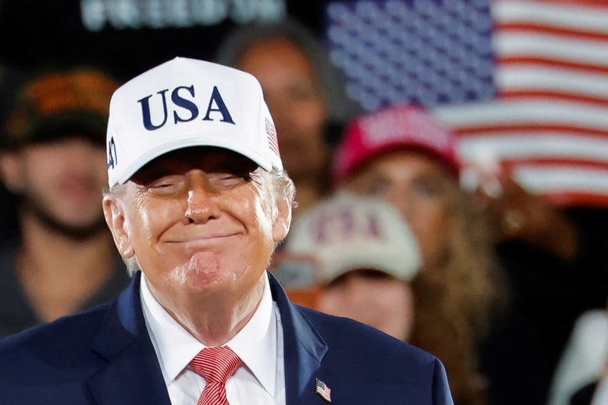 US President Donald Trump smiles as he looks at supporters after leaving the stage during a campaign rally at Pitt-Greenville Airport in Greenville, North Carolina, US, October 20, 2026. REUTERS/Jonathan Drake