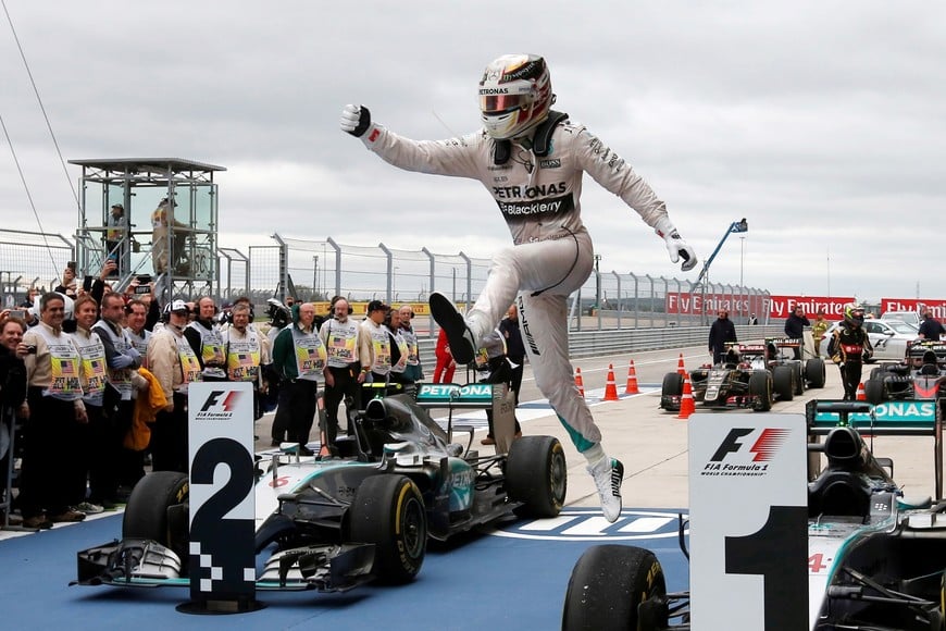 FILE PHOTO: Mercedes Formula One driver Lewis Hamilton of Britain leaps off of his car after winning the U.S. F1 Grand Prix at the Circuit of The Americas in Austin, Texas October 25, 2015. Hamilton clinched his third Formula One world championship on Sunday after winning a thrilling and unpredictable U.S. Grand Prix for Mercedes. REUTERS/Adrees Latif/File Photo