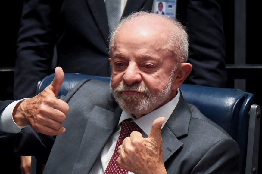 Brazilian President Luiz Inacio Lula da Silva gestures as he celebrates during a ceremony to promulgate constitutional amendments ending Brazil's six-days-on, one-day-off workweek and establishing special retirement rules for law enforcement officers, at the Federal Senate in Brasilia, Brazil, October 16, 2026. REUTERS/Diego Herculano