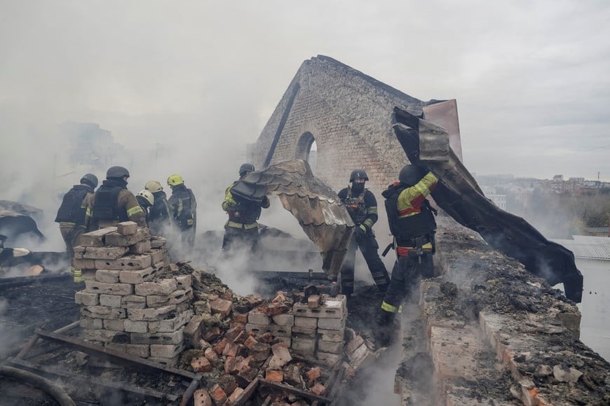 Firefighters work at the site of an office building damaged during a Russian jet drone strike, amid Russia's attack on Ukraine, in Kharkiv, Ukraine, October 23, 2026. REUTERS/Sofiia Gatilova