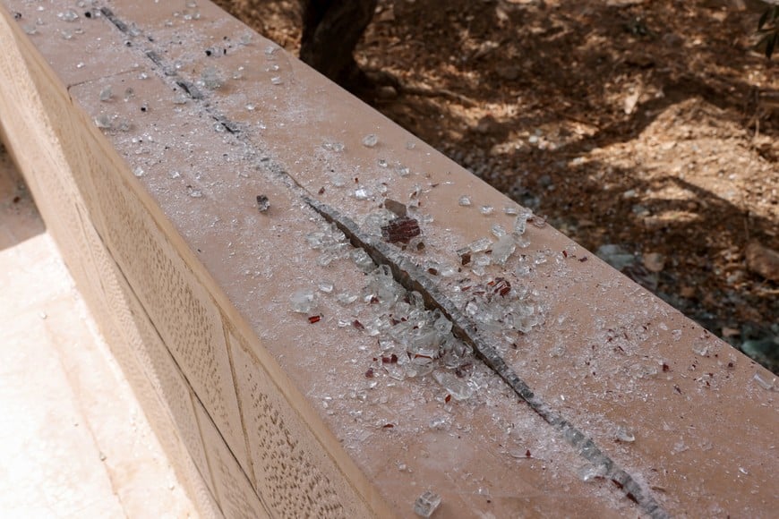 Pieces of shattered glass at Saint George’s Greek Orthodox Church, where gunmen opened fire during a funeral the previous day, in the village of Hamoud, Karak, Jordan, October 24, 2026. REUTERS/Alaa Al Sukhni