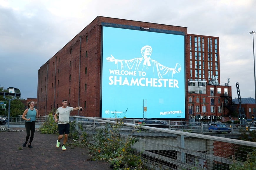 Soccer Football - General view of a billboard displaying the phrase "WELCOME TO SHAMCHESTER" orchestrated by the betting company Paddy Power following a reported guilty verdict against Manchester City in their financial regulations case, in Manchester, Britain, September 30, 2026 REUTERS/Phil Noble TPX IMAGES OF THE DAY