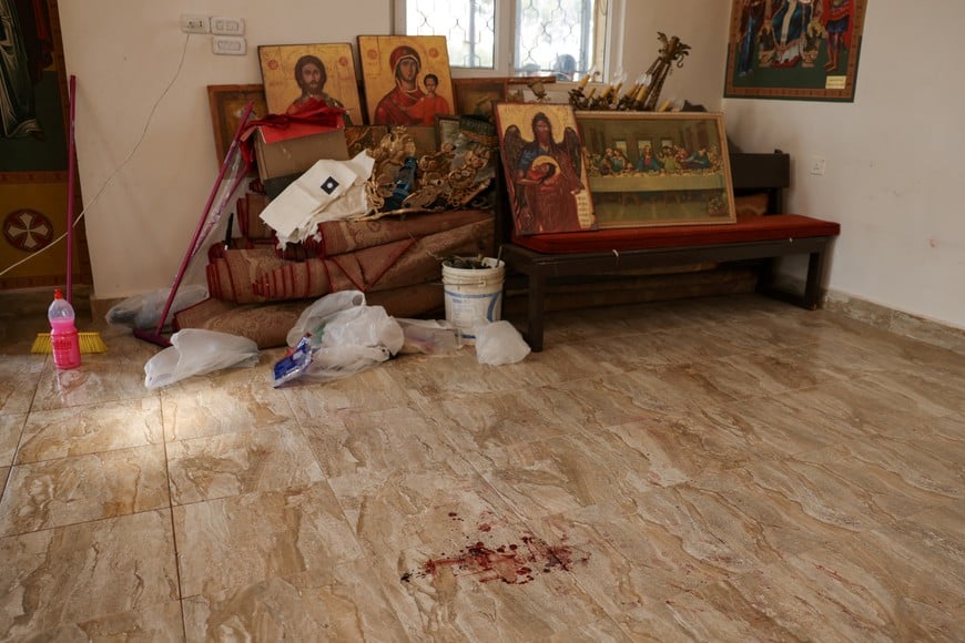 A bloodstain at Saint George’s Greek Orthodox Church, where gunmen opened fire during a funeral the previous day, in the village of Hamoud, Karak, Jordan, October 24, 2026. REUTERS/Alaa Al Sukhni