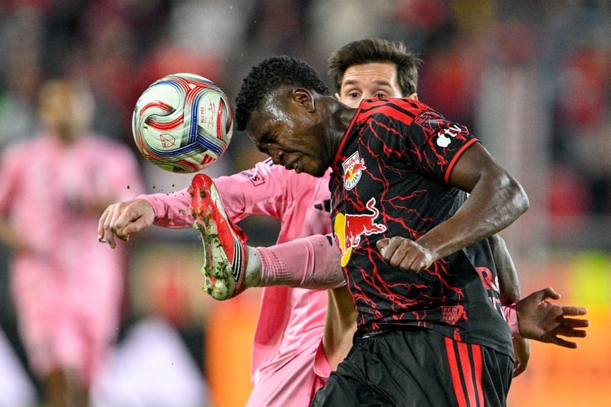 Oct 24, 2026; Harrison, New Jersey, USA; Red Bull New York defender Julian Bazan (14) heads the ball off the foot of Inter Miami CF forward Leo Messi (10) during the second half at Sports Illustrated Stadium. Mandatory Credit: Mark Smith-Imagn Images