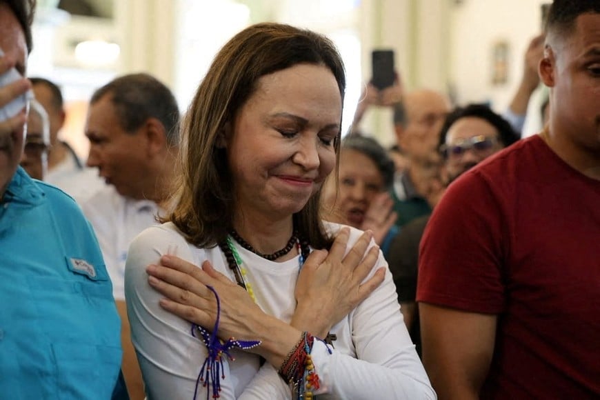Venezuelan opposition leader Maria Corina Machado gestures upon arriving at a church after returning to the country following nearly a year abroad, in Lara, Venezuela, October 25, 2026. Vente Venezuela Press/Handout via REUTERS. NO RESALES. THIS IMAGE HAS BEEN SUPPLIED BY A THIRD PARTY.