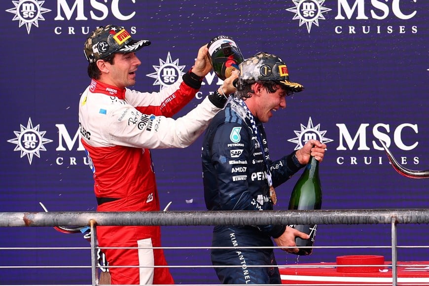 Formula One F1 - United States Grand Prix - Circuit of the Americas, Austin, Texas, U.S. - October 25, 2026
Mercedes' Andrea Kimi Antonelli celebrates on the podium after winning the United States Grand Prix alongside second placed Ferrari's Charles Leclerc REUTERS/Mike Segar