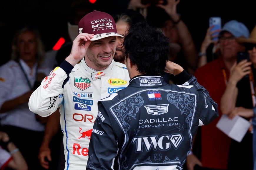 Formula One F1 - United States Grand Prix - Circuit of the Americas, Austin, Texas, U.S. - October 25, 2026
Third placed Red Bull's Max Verstappen speaks with Cadillac's Sergio Perez after the race REUTERS/Kaylee Greenlee