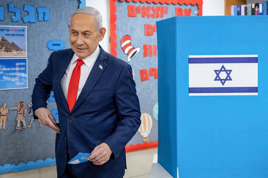 Israel's Prime Minister Benjamin Netanyahu reacts after filling out his ballot before voting at a polling station in Jerusalem on October 27, 2026, on the day of Israel's legislative election.  YONATAN SINDEL/Pool via REUTERS     TPX IMAGES OF THE DAY