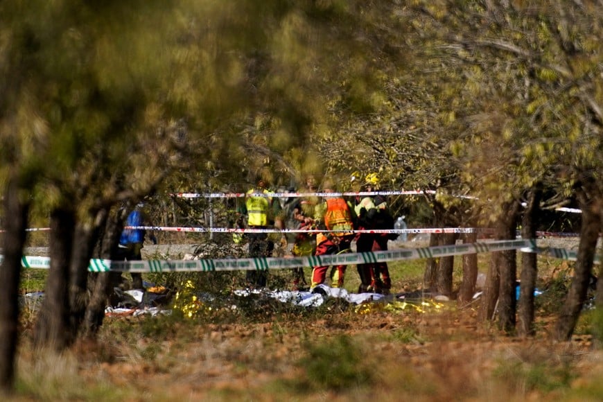 Rescue personnel work at the site of the collision of two high-speed trains between the towns of Mora and Orgaz, near Toledo, Spain, October 28, 2026. REUTERS/Ana Beltran