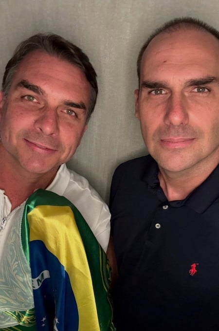Flavio Bolsonaro of the Liberal Party (PL) and his brother, Eduardo Bolsonaro, pose with a Brazilian flag at an unidentified location, in this picture obtained from social media and released on October 28, 2026. Eduardo Bolsonaro via Instagram/via REUTERS  THIS IMAGE HAS BEEN SUPPLIED BY A THIRD PARTY. MANDATORY CREDIT. NO RESALES. NO ARCHIVES.