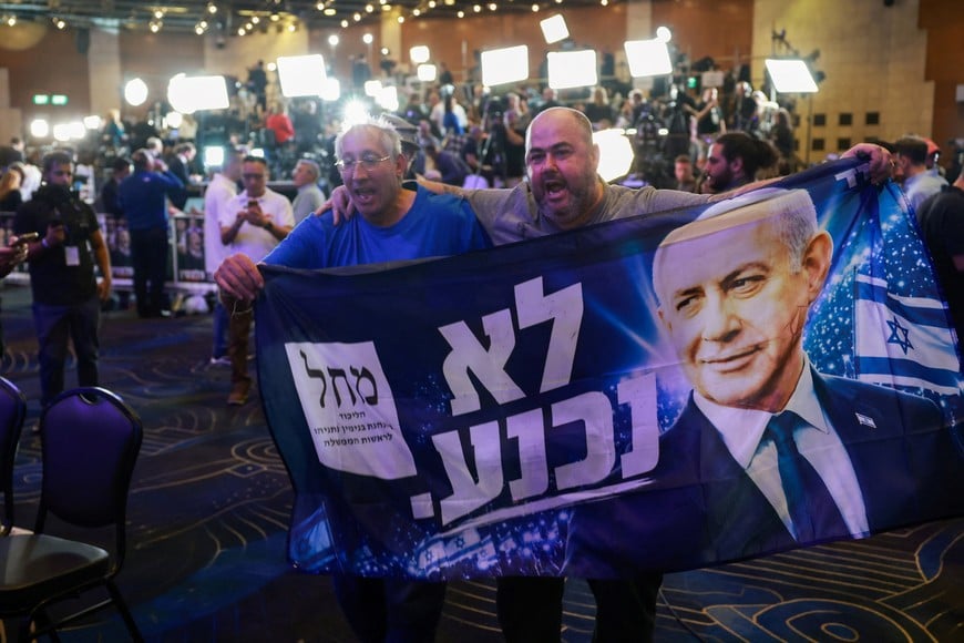 Supporters hold a banner depicting Israeli Prime Minister and Likud party leader Benjamin Netanyahu during Israel's national election, at Likud's election headquarters in Jerusalem, October 27, 2026. REUTERS/Ronen Zvulun