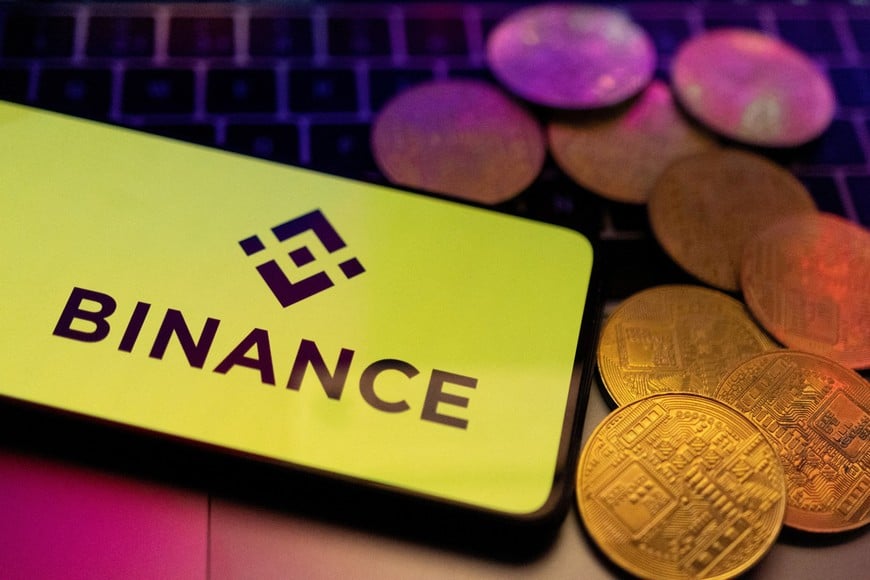 FILE PHOTO: A smartphone with displayed Binance logo and representation of cryptocurrencies are placed on a keyboard in this illustration taken, June 8, 2023. REUTERS/Dado Ruvic/Illustration/File Photo