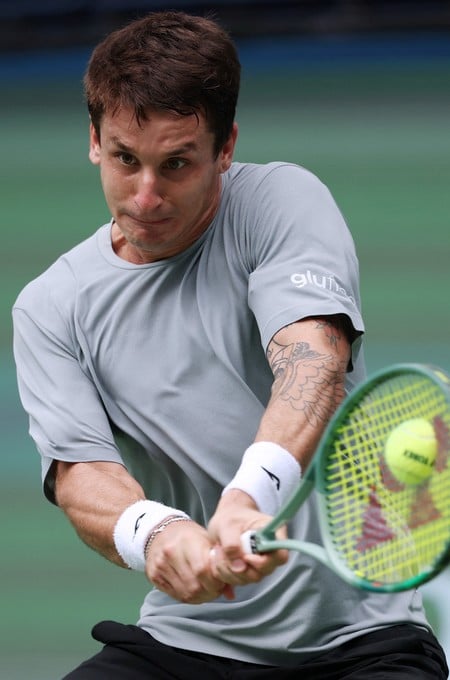 Tennis - ATP Masters 1000 - Shanghai Masters - Qizhong Forest Sports City Arena, Shanghai, China - October 10, 2026
Argentina's Camilo Ugo Carabelli in action during his round of 64 match against Canada's Felix Auger Aliassime REUTERS/Tyrone Siu