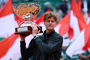 Tennis - ATP Masters 1000 - Monte Carlo Masters - Monte Carlo Country Club, Roquebrune-Cap-Martin, France - April 12, 2026
Italy's Jannik Sinner celebrates with the trophy after winning his final match against Spain's Carlos Alcaraz REUTERS/Manon Cruz     TPX IMAGES OF THE DAY